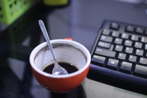 Empty Cup Of Coffee Beside Keyboard  - Ekoanug / Pixabay